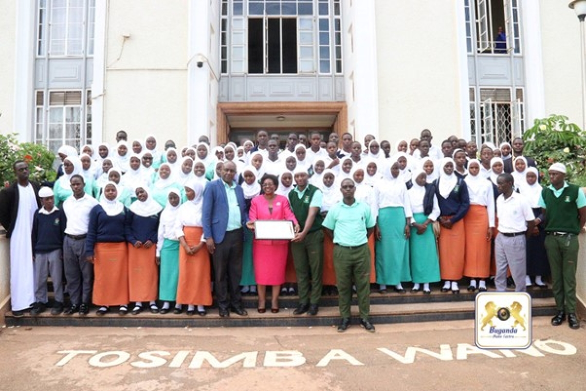 Hon. Clotilda Nakate Kikomeko warmly welcomes students from Gombe SS to Bulange, Mengo Image